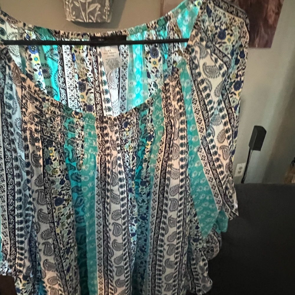 Summer light weight top with that gathering around the scoop neck. Sever designs